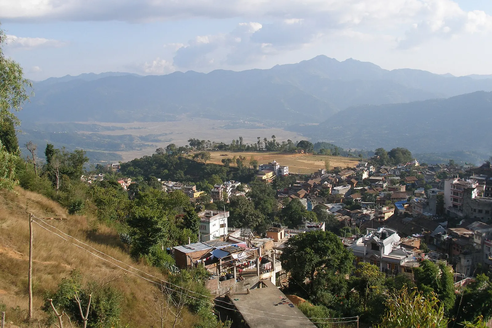 Houses of Tansen spreading down the hillside, with the hills of Palpa beyond.