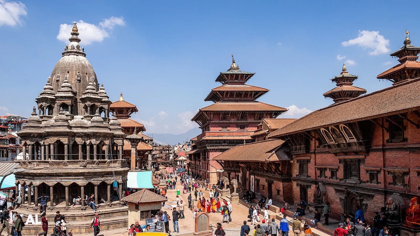Patan Durbar Square with the stone Krishna Mandir and tiered pagoda temples beside the old royal palace