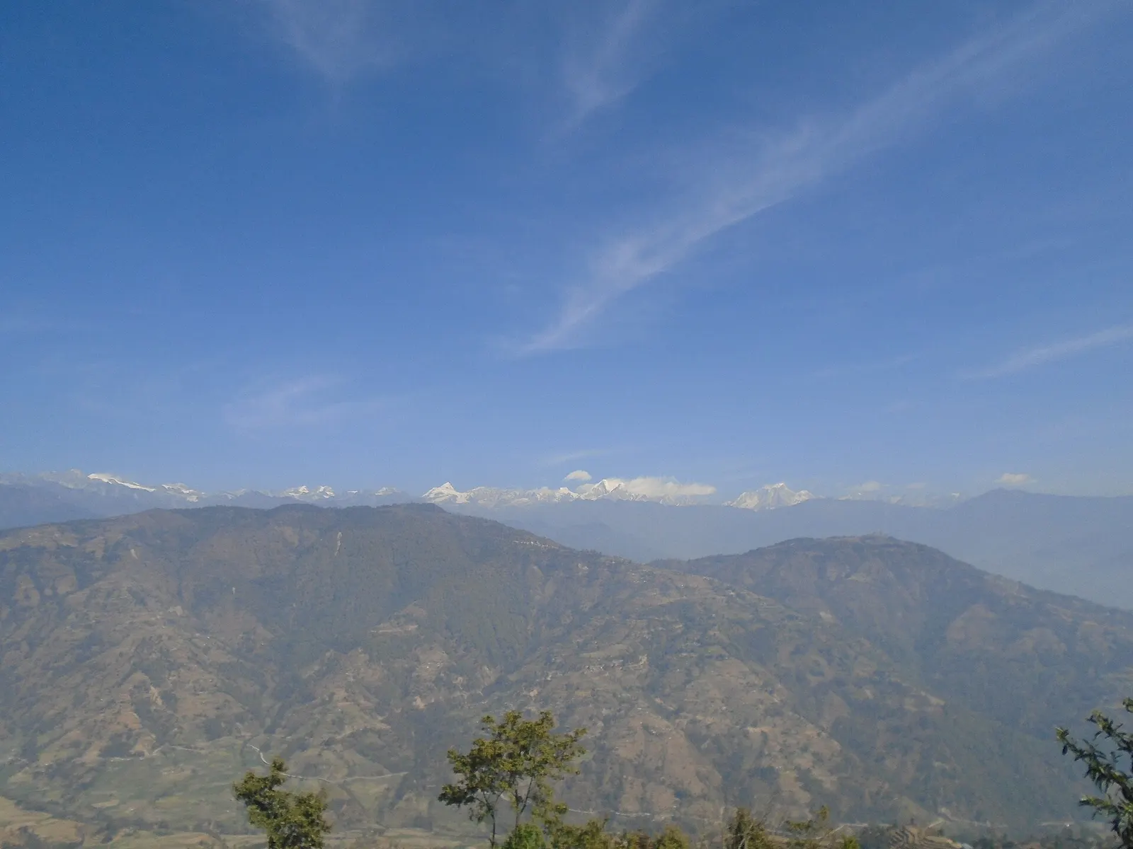 Forested Helambu ridges with the Jugal Himal behind, seen from Bhotechaur.