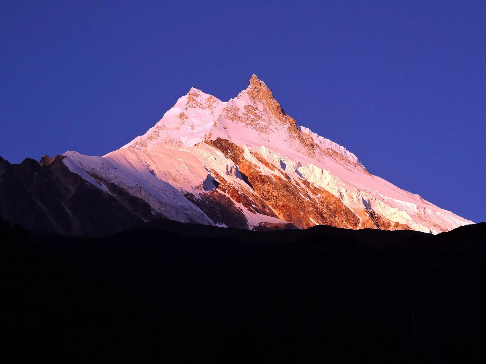 The snow-covered summit of Manaslu seen from Samagaon in the upper Budhi Gandaki valley.