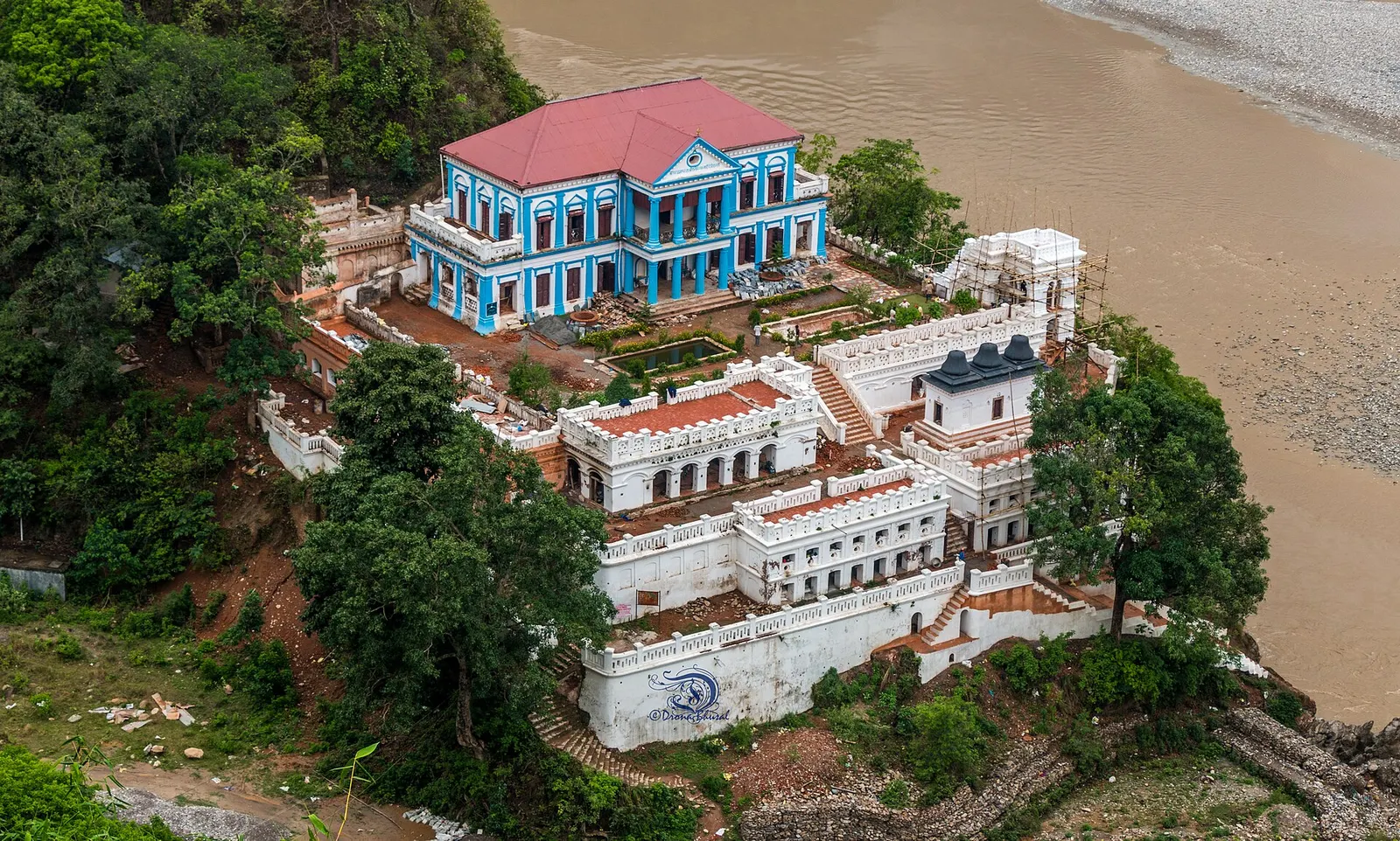 Aerial view of the blue-and-white Rani Mahal palace complex beside the Kali Gandaki in Palpa.