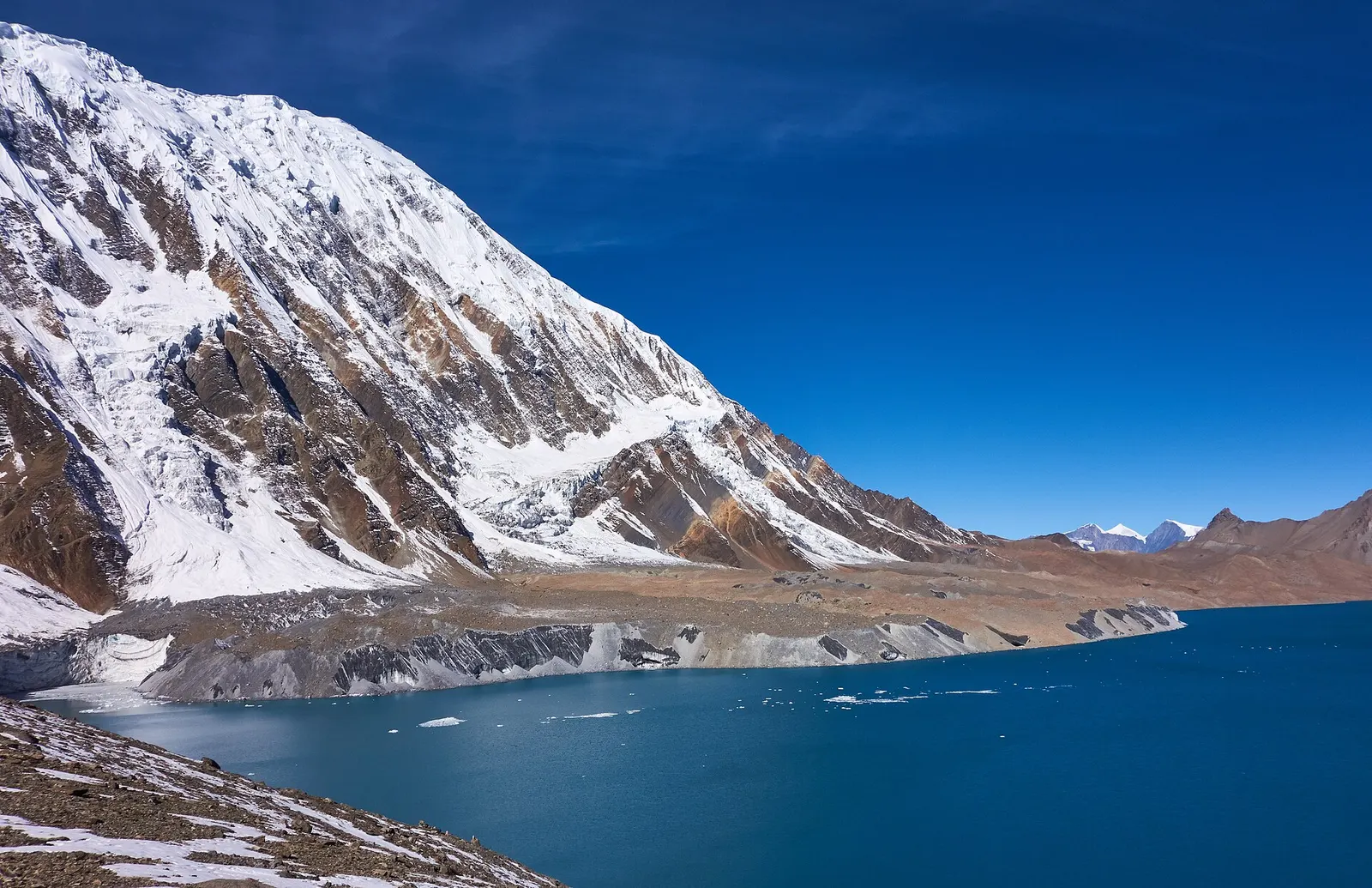 Tilicho Peak and its glaciers rising above the southern shore of Tilicho Lake.